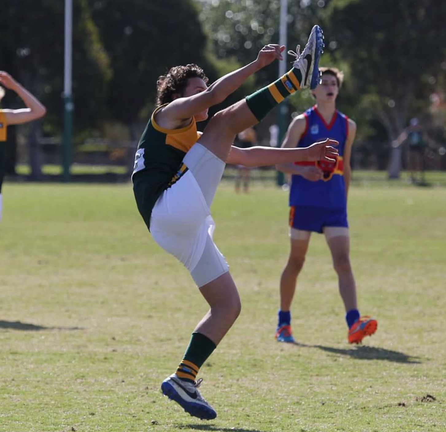 Tom Maginness — junior footy kicking action